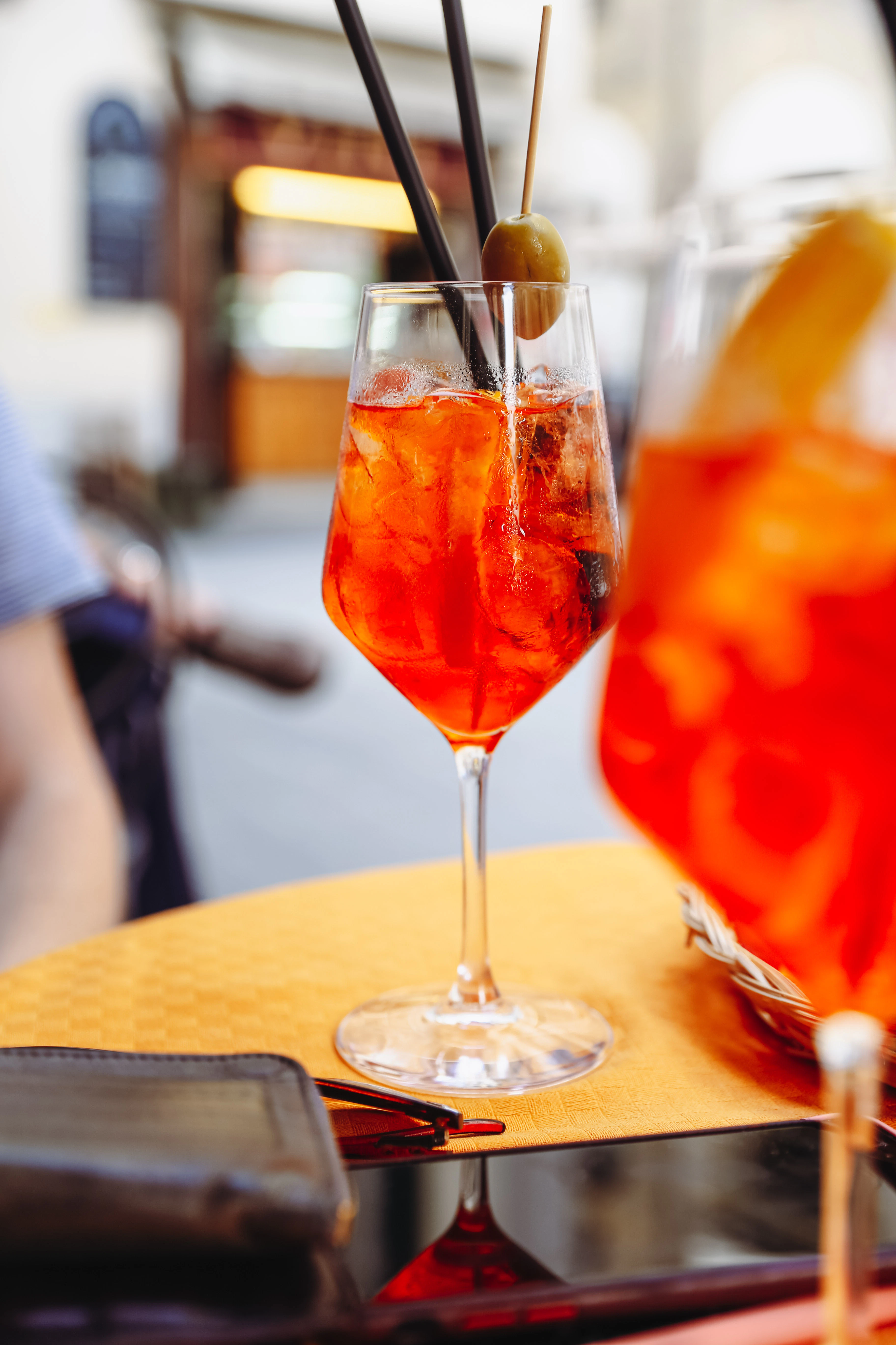 Two Aperol Spritz are on a table.