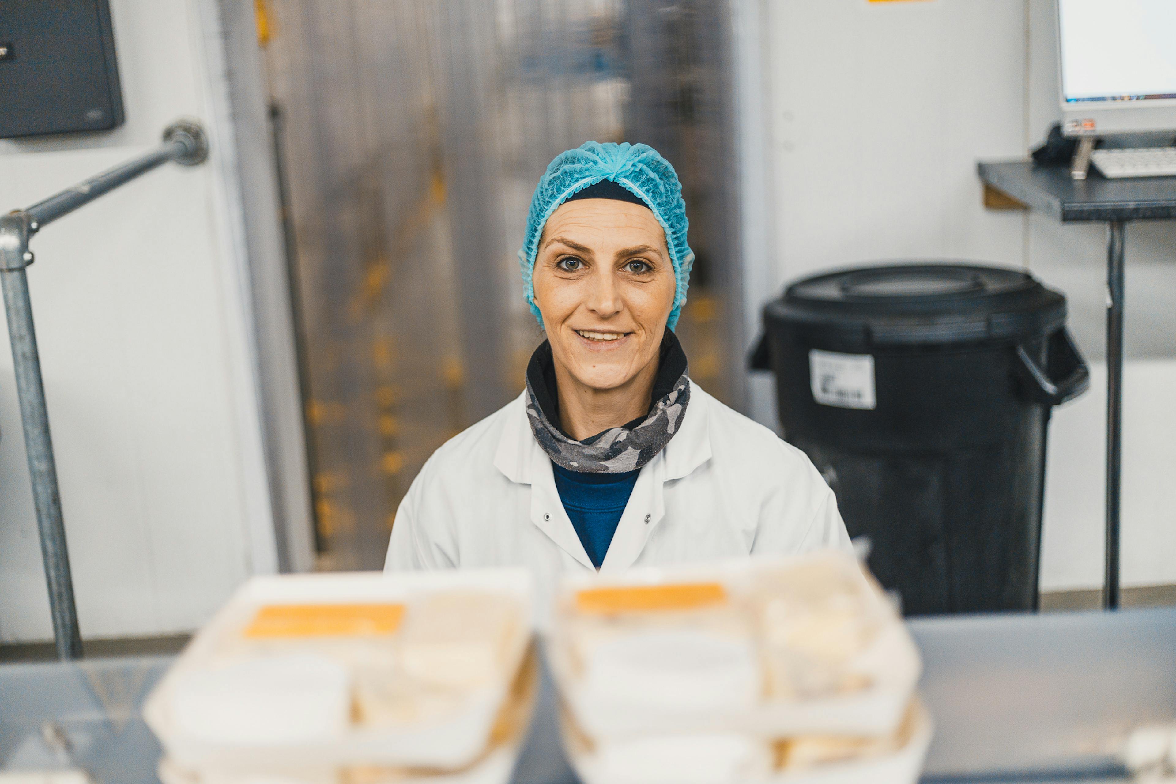 Food factory worker with hair net