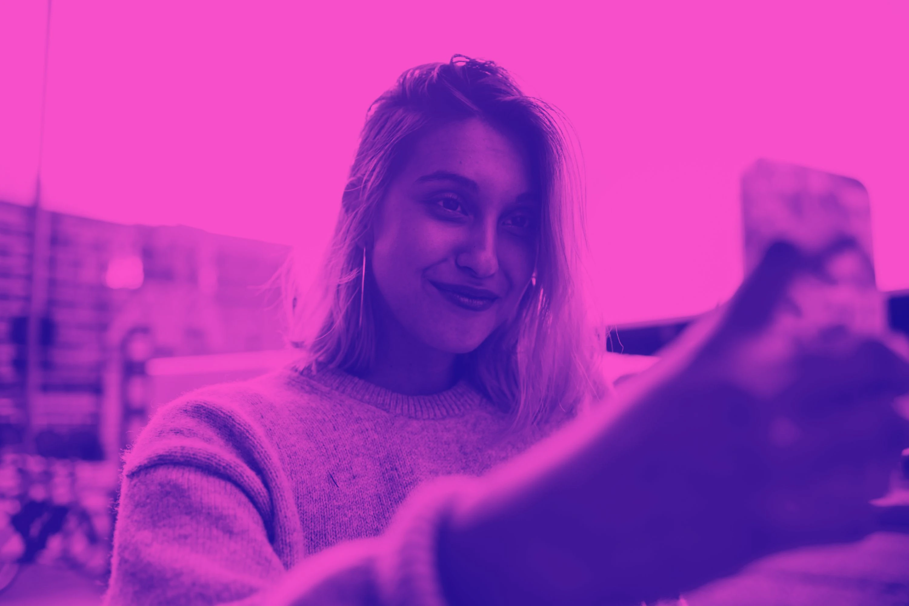 a girl on her phone, with pink and purple overlay