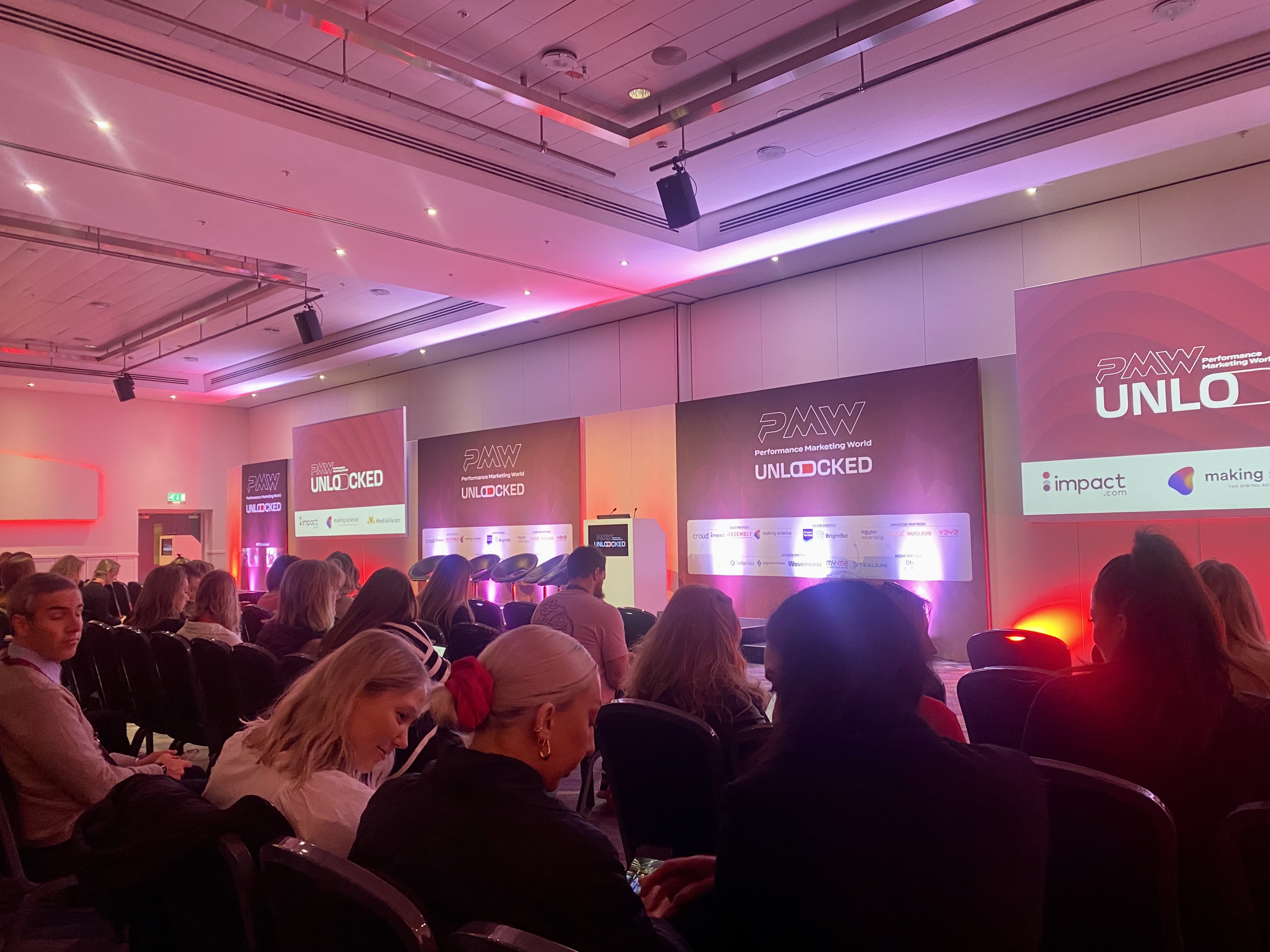 a photo of the performance marketing event. There is a crowd of people all sitting down, waiting for the event to start.