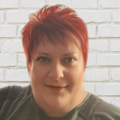 Lorraine smiling on a white background