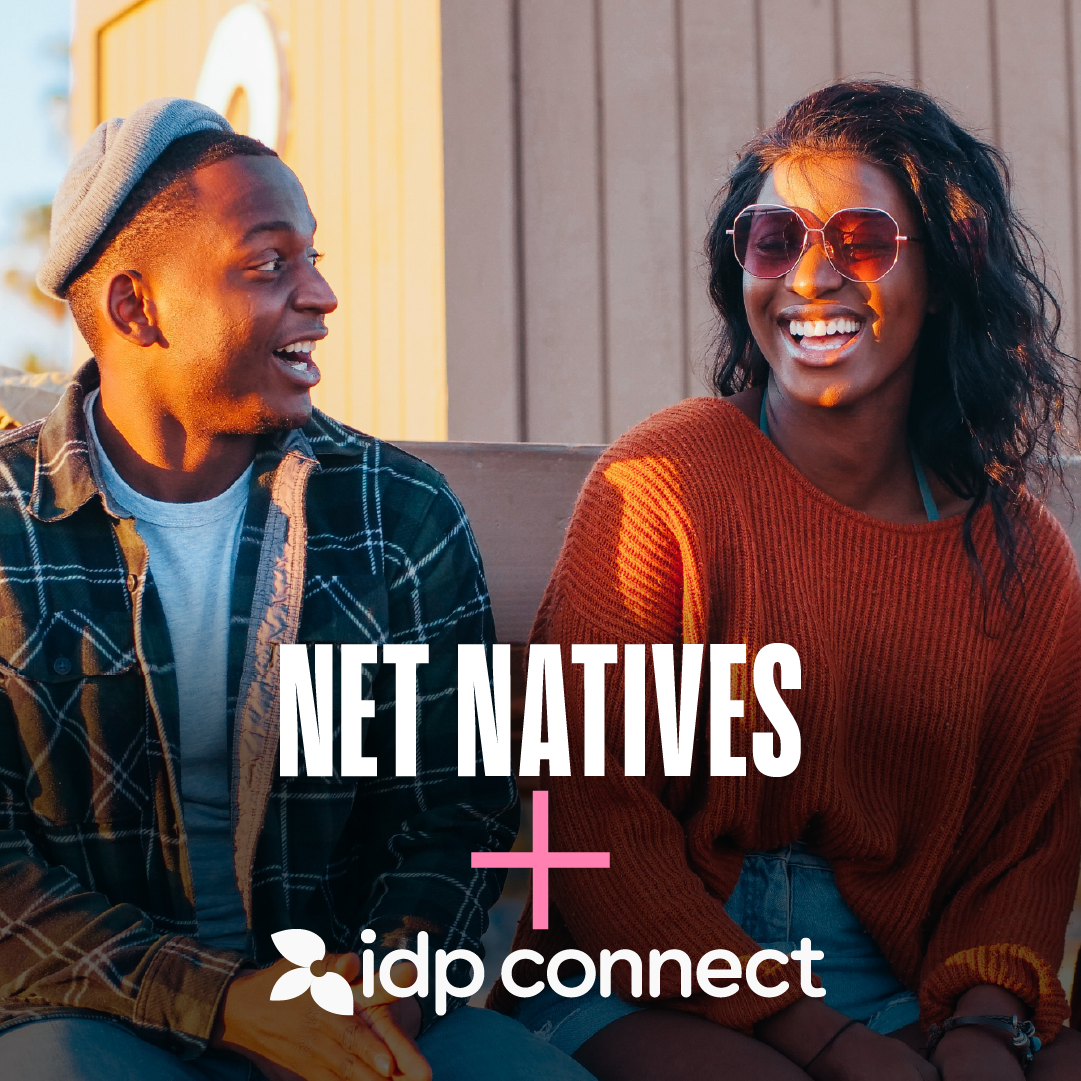 Two students laughing in a sunset